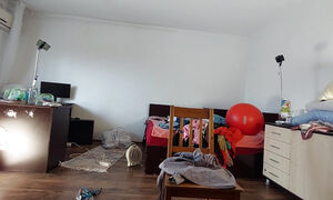 The sexy wife has fun testing clothes and cuts them. The brunette dances naked through the house.