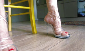 dangling high heels and teasing feet of my wife
