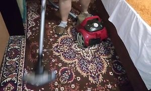 Ellie cleans with a vacuum cleaner