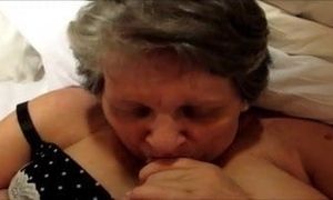 Grandma Kathy asks to put a fuckpole in her jaws during masturba