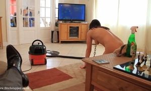 Submissive slave girl cleaning house